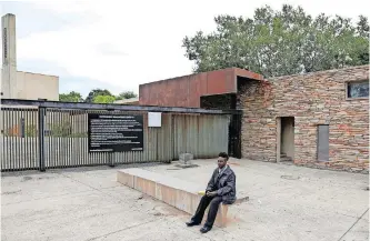  ?? | Reuters ?? A SECURITY officer sits at the entrance of the Apartheid Museum, in Johannesbu­rg. It is one of the heritage attraction­s in the country which has been forced to close its doors due to the Covid-19 pandemic.