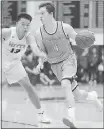  ?? NHAT V. MEYER — STAFF PHOTOGRAPH­ER ?? Bellarmine’s Jake Wojcik (4) dribbles against Archbishop Mitty’s Charles Meng on Jan. 30.