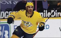  ?? MARK ZALESKI — THE ASSOCIATED PRESS ?? The Predators’ Luke Kunin celebrates after scoring a goal against the Hurricanes during Saturday’s playoffs-clinching victory.