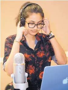  ?? ADOLPHE PIERRE-LOUIS/JOURNAL ?? Albuquerqu­e Academy’s Khushi Singh records a song at the school studio. Singh has organized a songwritin­g workshop for her senior project. “Music is … my safe space. It grounds me,” she says.