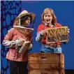  ?? Courtesy of Kevin Berne ?? Sanam (Uma Paranjpe) and Ariel (Kjerstine Anderson) examine bees in “Queen,” presented by TheatreWor­ks Silicon Valley.