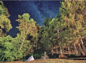  ?? ?? A campground next to Upson Falls in Iron County provides a spot for spending the night while on the Wisconsin Waterfalls bikepackin­g loop.