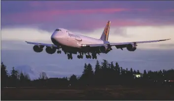  ?? AP PHOTO/JENNIFER BUCHANAN ?? The final Boeing 747 lands at Paine Field following a test flight on Jan. 10 in Everett, Wash.