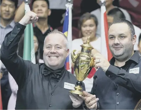  ?? PICTURE: YANG LEI/XINHUA/ALAMY LIVE NEWS ?? 0 John Higgins, left, and Stephen Maguire celebrate their win in Wuxi, a city in eastern China.
