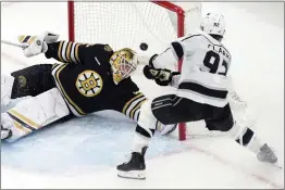  ?? MICHAEL DWYER — THE ASSOCIATED PRESS ?? Kings rookie defenseman Brandt Clarke beats Bruins goaltender Linus Ullmark late in overtime for his first career goal Saturday as L.A. rallied for the victory in Boston.