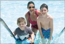  ?? Photo by Susan Holland ?? Cathie West of Rogers brought her grandsons, Easton Ridpath, 5, of Rogers, and Hayden Arnold, 9, of Pea Ridge, to enjoy a dip in the Gravette city pool on Saturday. The three were visiting West’s parents, Howard and Caryl West of Gravette, over the...