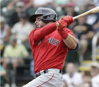  ?? AP FILE ?? ‘GOOD HANDS’: Red Sox catcher Kevin Plawecki hits a single during a spring training game against the Pittsburgh Pirates on Feb. 26.