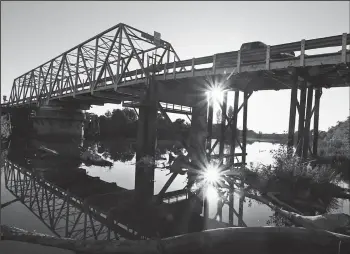  ?? LUIS SINCO/LOS ANGELES TIMES FILE PHOTOGRAPH ?? An old bridge spans Miner Slough, which separates Ryer and Sutter islands in the Sacramento River Delta near Courtland on Oct. 11, 2010.