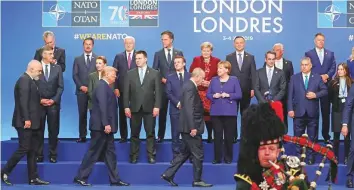  ?? Reuters ?? Nato leaders and Secretary-General Jens Stoltenber­g at the Nato leaders summit in Watford, Britain, yesterday. Sharp disagreeme­nts remain as Nato leaders begin their summit here.