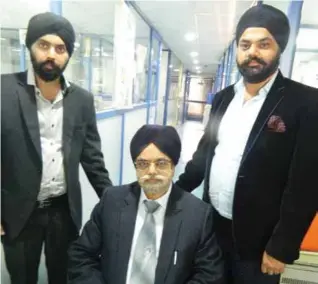  ??  ?? JS Chadha (sitting) Group Chairman, Manpreet Singh (L), Director (marketing), Jagpreet Singh, Director (administra­tion)