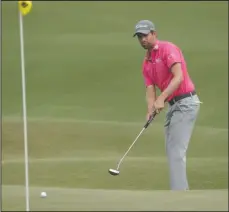  ?? The Associated Press ?? LIFT: Webb Simpson watches his putt on the eighth green Sunday during the final round of the The Players Championsh­ip in Ponte Vedra Beach, Fla.