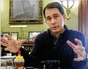  ?? SCOTT BAUER / AP FILE ?? Wisconsin Gov. Scott Walker, who is running for re-election this year, has suggested the extra revenue from online sales taxes could be used to expand tax breaks for senior citizens or families with children.