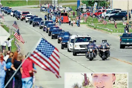  ?? [PHOTO BY JIM BECKEL, THE OKLAHOMAN] ?? The hearse carrying the flag-draped casket of slain police officer Justin Terney travels on North Broadway toward downtown Tecumseh.