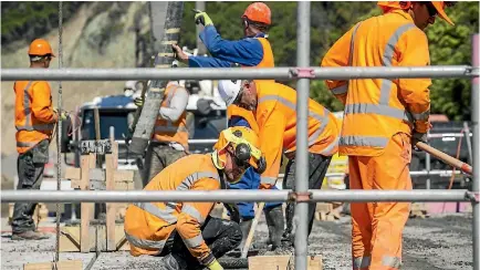  ?? PHOTO: DAVID WALKER/STUFF ?? Roadworker­s concreting one of the many bridges along State Highway 1, north of Kaikoura.