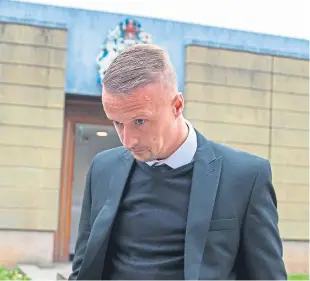  ?? Picture: Duncan McGlynn. ?? Celtic player Griffiths arrives at court for trial.