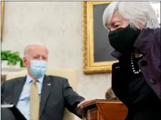  ?? AP PHOTO/ANDREW HARNIK ?? President Joe Biden, accompanie­d by Treasury Secretary Janet Yellen (right) speaks as he gets his weekly economic briefing in the Oval Office of the White House, on Friday in Washington.