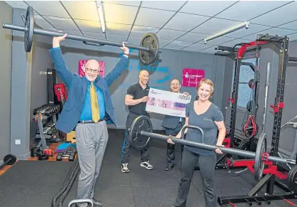  ?? Picture: Kenny Smith. ?? Deputy First Minister John Swinney and Neil Ritch, director at the National Lottery Community Fund Scotland, presented the cheque to owners Andy Douglas and his wife Jessica.