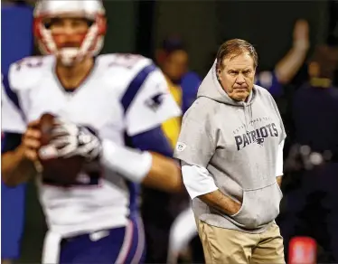  ?? SAM RICHE / TNS ?? New England Patriots head coach Bill Belichick and quarterbac­k Tom Brady are the franchise’s two constants, but there will be a new cast of characters surroundin­g them in the coming season.