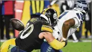  ?? AP ?? Seattle Seahawks quarterbac­k Geno Smith (7) fumbles as Pittsburgh Steelers outside linebacker T.J. Watt (90) tackles him in overtime Sunday. The Steelers won 23-20.