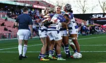  ?? Photo / Photosport ?? Auckland celebrate a try in the semifinal win.