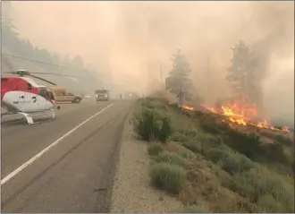  ?? TOURISM VERNON/Special to the Herald ?? It was a dramatic scene along Highway 97 south of Peachland, as shown in this picture posted on Twitter. The Mount Eneas fire doubled in size, Thursday, and is now more than 1,000 hectares.