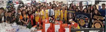  ??  ?? (Front row, from fourth left) Yeoh, Chuo and Parkson Miri outlet manager Tan Chee Kean with members of the three Leo Clubs and sponsoring Lions Clubs pose with gifts for the children.