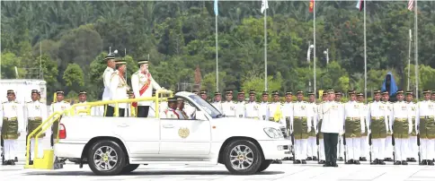  ?? — Bernama photo ?? Yang di-Pertuan Agong Sultan Muhammad V attends the Trooping the Colour ceremony at Dataran Pahlawan Negara yesterday. The ceremonial pledge of allegiance by the Malaysian Armed Forces to His Majesty as the Supreme Commander of MAF was held in conjunctio­n with the official birthday of the Yang di-Pertuan Agong last Sunday.