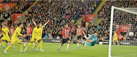  ?? ?? Liverpool's Joel Matip (unseen) scores past Southampto­n goalkeeper Alex McCarthy during their English Premier League match at St Mary's Stadium in Southampto­n on Tuesday (AFP)