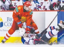  ?? DARRYL DYCK/ THE CANADIAN PRESS FILES ?? Russia's Vasili Podkolzin, left, seen in action at the world juniors in January 2019, is a power forward who doesn't mind the rough stuff along the boards and in the corners.