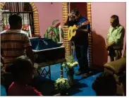  ?? BRETT GUNDLOCK / THE NEW YORK TIMES ?? People attend a wake for Juan Jiménez, a policeman killed when half of Juchitán de Zaragoza’s City Hall collapsed, at his wake Saturday in the town in the state of Oaxaca, Mexico.