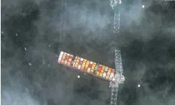  ?? MAXAR TECHNOLOGI­ES VIA THE ASSOCIATED PRESS ?? A satellite view of the Francis Scott Key Bridge that was struck by a container ship Tuesday in Baltimore. Building a replacemen­t for a bridge that crosses a vital shipping channel could cost hundreds of millions of dollars.