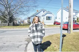  ?? BARB SWEET • CAPE BRETON POST ?? On Lingan Road in Whitney Pier, Morgan Krszwda is concerned about the speed of traffic and drives her son to school instead of having him cross the road to get the school bus in the mornings.