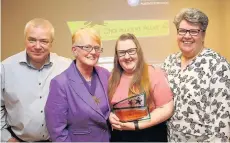 ??  ?? Pictured is Megan Taylor (centre) who won the Pride of Charnwood Award at the 2017 Pride of Charnwood Awards with her parents Roy Taylor (far left) and Debbie Taylor (far right) as she was presented by Deputy Mayor of Charnwood, Coun Paulin Ranson...