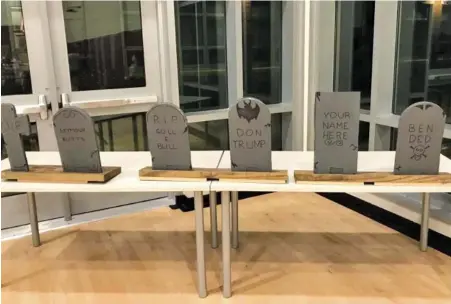  ?? PHOTO COURTESY OF AMANDA KESTERSON ?? PT-UHH-OHH: A game at a West Parish Elementary School parent teacher organizati­on fundraiser featured a tombstone depicting the name ‘Don Trump.’