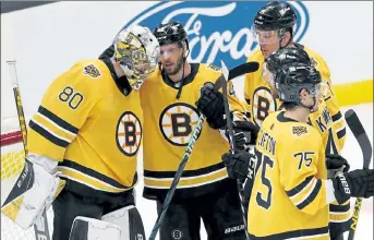  ?? AP ?? Boston Bruins goalie Daniel Vladar celebrates with teammates after defeating the Buffalo Sabres on Saturday.