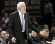  ?? AP PHOTO/TONY DEJAK ?? San Antonio Spurs head coach Gregg Popovich yells instructio­ns to players in the first half of Sunday’s game against the Cleveland Cavaliers in Cleveland.