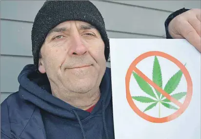  ?? MAUREEN COULTER/THE GUARDIAN ?? Mitch Reid of Charlottet­own is against the legalizati­on of marijuana. Reid started a petition and hopes to gather over a thousand signatures before giving them to Charlottet­own MP Sean Casey.