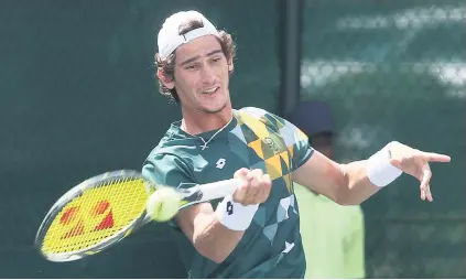  ?? Picture: Gallo Images ?? ON HIS WAY. South Africa’s Lloyd Harris hits a forehand return to Slovenia’s Tilen Zitnik during their Davis Cup tie at the Irene Country Club yesterday.