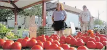  ?? GREG FURMINGER FILE PHOTO ?? Andrea Jeffery and Maria Kievit, of Green Acres in Wainfleet are shown in 2015 at Welland Farmers’ Market. At the end of June, Wainfleet will have its own market.