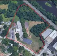  ?? IMAGE FROM PHOENIXVIL­LE GREEN TEAM WEBSITE ?? An aerial photo of the 7.4acre property, outlined in red, that the Phoenixvil­le School Board voted Monday to sell to a developer.