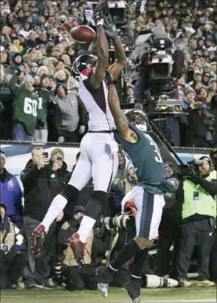  ?? CURTIS COMPTON — THE ASSOCIATED PRESS ?? The last time the Eagles faced Atlanta, Jalen Mills, right, did just enough to keep Julio Jones from making this catch on fourth down in the end zone in the playoffs. The Eagles would go on to win Super Bowl 52.