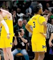  ?? GETTY IMAGES ?? Cassius Winston and Kenny Goins celebrate during Michigan State’s 65-60 victory against Michigan on Sunday.