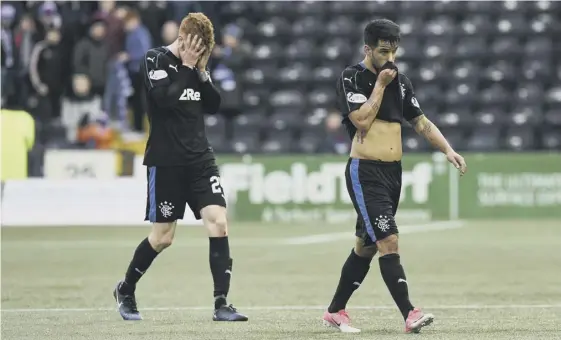  ??  ?? 2 Dejection for Rangers’ David Bates, left, and Daniel Candeias as they leave the pitch after the 2-1 defeat by Kilmarnock at Rugby Park. Rangers had led 1-0 until the 77th minute.