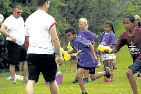  ?? HARLEY DAVIDSON/POSTMEDIA NEWS ?? Around 400 kids gathered in Burgoyne Woods Park for the fourth annual CTFS Jumpstart Games in St. Catharines Thursday. The event was rained out two hours into the day but during the morning kids got to enjoy a couple hours of activities.