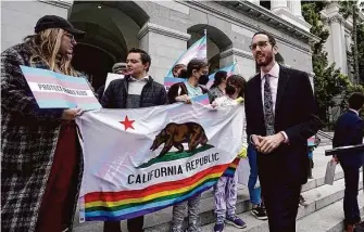  ?? Rich Pedroncell­i/Associated Press 2022 ?? State Sen. Scott Wiener, D-San Francisco, (right) authored SB923, which was enacted in September and provides legal refuge to displaced transgende­r youth and their families.