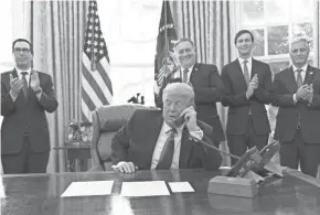  ?? ALEX BRANDON/AP ?? President Donald Trump talks to the leaders of Sudan and Israel from the Oval Office on Friday.