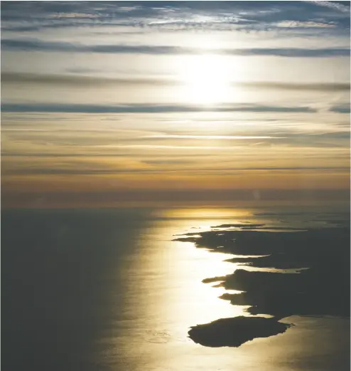  ?? JULIA SMITH ?? A landscape photograph by Julia Smith taken from the cockpit of New Brunswick education minister Dominic Cardy’s aircraft. Cardy is a believer in a bright, post-pandemic economic future for Atlantic Canada.