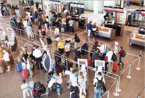  ?? RYAN REMIORZ/THE CANADIAN PRESS FILES ?? The proposed air passenger protection legislatio­n would impose minimum levels of compensati­on for delays within an airline’s control such as commercial overbookin­g or scheduled maintenanc­e.