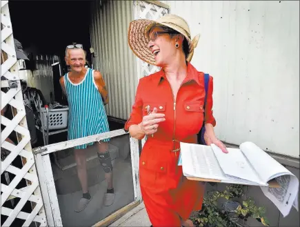  ?? David Becker ?? Las Vegas Review-journal @davidjaybe­cker Clark County commission­er and Nevada gubernator­ial candidate Chris Giunchigli­ani, right, smiles after speaking with residents as she canvasses potential voters Tuesday at the Riviera Mobile Home Park.