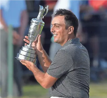  ?? STEVE FLYNN/USA TODAY SPORTS ?? Francesco Molinari shows off the Claret Jug after winning the British Open Championsh­ip on Sunday at Carnoustie Golf Links in Scotland.